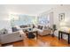 Bright living room with hardwood floors and ample seating at 8089 Greenwood Blvd, Denver, CO 80221