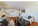 Living room with hardwood floors and view to kitchen at 8089 Greenwood Blvd, Denver, CO 80221