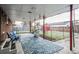 Covered patio with flagstone flooring and built-in grill at 8089 Greenwood Blvd, Denver, CO 80221