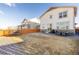 Large fenced backyard offering a trampoline, grill and outdoor seating at 26361 E 5Th Pl, Aurora, CO 80018