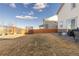 Spacious fenced backyard with patio seating and landscaping at 26361 E 5Th Pl, Aurora, CO 80018