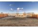 Fenced backyard offering trees and trampoline at 26361 E 5Th Pl, Aurora, CO 80018
