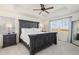 Primary bedroom showcasing a coffered ceiling and large windows providing ample natural light at 26361 E 5Th Pl, Aurora, CO 80018
