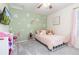 Lovely bedroom with playful decor, a mounted TV, and cozy furnishings at 26361 E 5Th Pl, Aurora, CO 80018