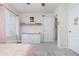 Charming bedroom with a decorative shelf and ample natural light from the window at 26361 E 5Th Pl, Aurora, CO 80018