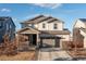 Charming two-story home featuring a spacious driveway and attached two-car garage at 26361 E 5Th Pl, Aurora, CO 80018