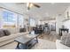 Open concept space features living room, dining area and kitchen with tons of natural light at 26361 E 5Th Pl, Aurora, CO 80018