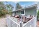 Relaxing backyard patio with charming greenery and outdoor seating at 881 S Pearl St, Elizabeth, CO 80107