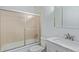 Cozy bathroom with white vanity, marble countertop and sliding shower doors at 881 S Pearl St, Elizabeth, CO 80107