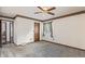 Bedroom featuring a carpeted floor, a ceiling fan, and a window with sheer curtains at 881 S Pearl St, Elizabeth, CO 80107
