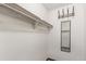 Walk-in closet featuring hanging rack, overhead shelf, and full length mirror at 881 S Pearl St, Elizabeth, CO 80107