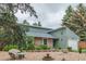 Charming single-Gathering home with a stone exterior, attached garage, and well-maintained front yard at 881 S Pearl St, Elizabeth, CO 80107