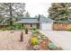 Charming single-Gathering home with a stone exterior, attached garage, and well-maintained front yard at 881 S Pearl St, Elizabeth, CO 80107