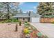 Charming single-Gathering home with a stone exterior, attached garage, and well-maintained front yard at 881 S Pearl St, Elizabeth, CO 80107