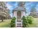 Charming backyard gazebo with decorative lattice, steps, and landscaping at 881 S Pearl St, Elizabeth, CO 80107