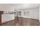 Bright living room with hardwood floors, white walls, and French doors leading to the outside at 881 S Pearl St, Elizabeth, CO 80107