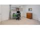 Office space with a desk, computer, and a dresser, bathed in natural light from a window at 12661 W Alameda Dr, Lakewood, CO 80228