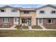 Charming townhome featuring brick accents, neutral siding, and well-maintained landscaping at 12661 W Alameda Dr, Lakewood, CO 80228