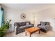 Inviting living room featuring comfortable seating and warm, natural light at 12661 W Alameda Dr, Lakewood, CO 80228