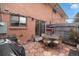 Back patio with a table and chairs, offers a cozy outdoor space for relaxation and dining at 12661 W Alameda Dr, Lakewood, CO 80228