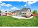 This home features a well-maintained backyard with a white pergola and patio seating area at 915 S Mckinley Ave, Fort Lupton, CO 80621