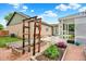 Backyard with garden beds, a patio, and a well-maintained lawn at 915 S Mckinley Ave, Fort Lupton, CO 80621