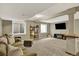 Finished basement area with comfortable seating, decor, and neutral carpeting at 915 S Mckinley Ave, Fort Lupton, CO 80621