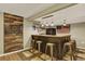 Finished basement with a bar area, rustic wood accents, and pendant lighting at 915 S Mckinley Ave, Fort Lupton, CO 80621