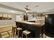 Finished basement with bar featuring pendant lighting and comfortable seating at 915 S Mckinley Ave, Fort Lupton, CO 80621
