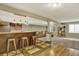 Spacious finished basement area with a bar and seating, with gray carpet at 915 S Mckinley Ave, Fort Lupton, CO 80621