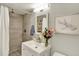 Updated bathroom featuring a tiled shower and modern vanity at 915 S Mckinley Ave, Fort Lupton, CO 80621