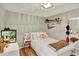 This charming bedroom features a cozy bed, playful decor, and ample natural light at 915 S Mckinley Ave, Fort Lupton, CO 80621