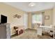 Cozy bedroom featuring neutral decor, window, desk, and plenty of storage at 915 S Mckinley Ave, Fort Lupton, CO 80621