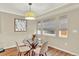 Cozy dining area with modern lighting, decor, and lots of natural light at 915 S Mckinley Ave, Fort Lupton, CO 80621