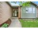 Inviting front entrance showcasing a brick facade, landscaped garden, and well-lit porch at 915 S Mckinley Ave, Fort Lupton, CO 80621