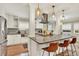 Bright kitchen featuring granite countertops, stainless steel appliances, and pendant lighting at 915 S Mckinley Ave, Fort Lupton, CO 80621