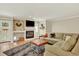 Comfortable living room with a fireplace, modern furnishings, and stylish decor at 915 S Mckinley Ave, Fort Lupton, CO 80621