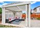 Inviting outdoor patio area with comfortable seating and a fire pit at 915 S Mckinley Ave, Fort Lupton, CO 80621