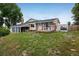 Expansive backyard featuring a deck and a large, grassy area perfect for outdoor activities and entertaining at 7210 Otis Ct, Arvada, CO 80003