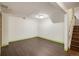 The basement boasts clean design and wood-look floors, and easy stair access at 7210 Otis Ct, Arvada, CO 80003