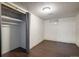 Clean bedroom with closet and dark wood look floors at 7210 Otis Ct, Arvada, CO 80003