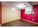 This bedroom has light colored trim and wood-look floors at 7210 Otis Ct, Arvada, CO 80003
