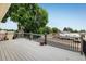 Back deck featuring wood railings and view of the neighborhood at 7210 Otis Ct, Arvada, CO 80003