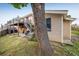 Exterior view of a home featuring a raised deck accessible by stairs at 7210 Otis Ct, Arvada, CO 80003