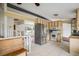 Bright kitchen with stainless steel appliances and open layout at 7210 Otis Ct, Arvada, CO 80003
