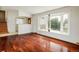 Bright living room features hardwood floors and a large bay window at 7210 Otis Ct, Arvada, CO 80003