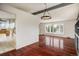 Open-concept living room with hardwood floors and large bay window at 7210 Otis Ct, Arvada, CO 80003