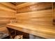 Wooden sauna featuring a bench and traditional sauna accessories at 7210 Otis Ct, Arvada, CO 80003