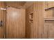 Modern tiled shower with dual recessed shelves and waterfall shower head at 7210 Otis Ct, Arvada, CO 80003