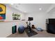 Bright basement area perfect for fitness, featuring a window and adjacent to a kitchenette at 42 Blue Sage, Littleton, CO 80127